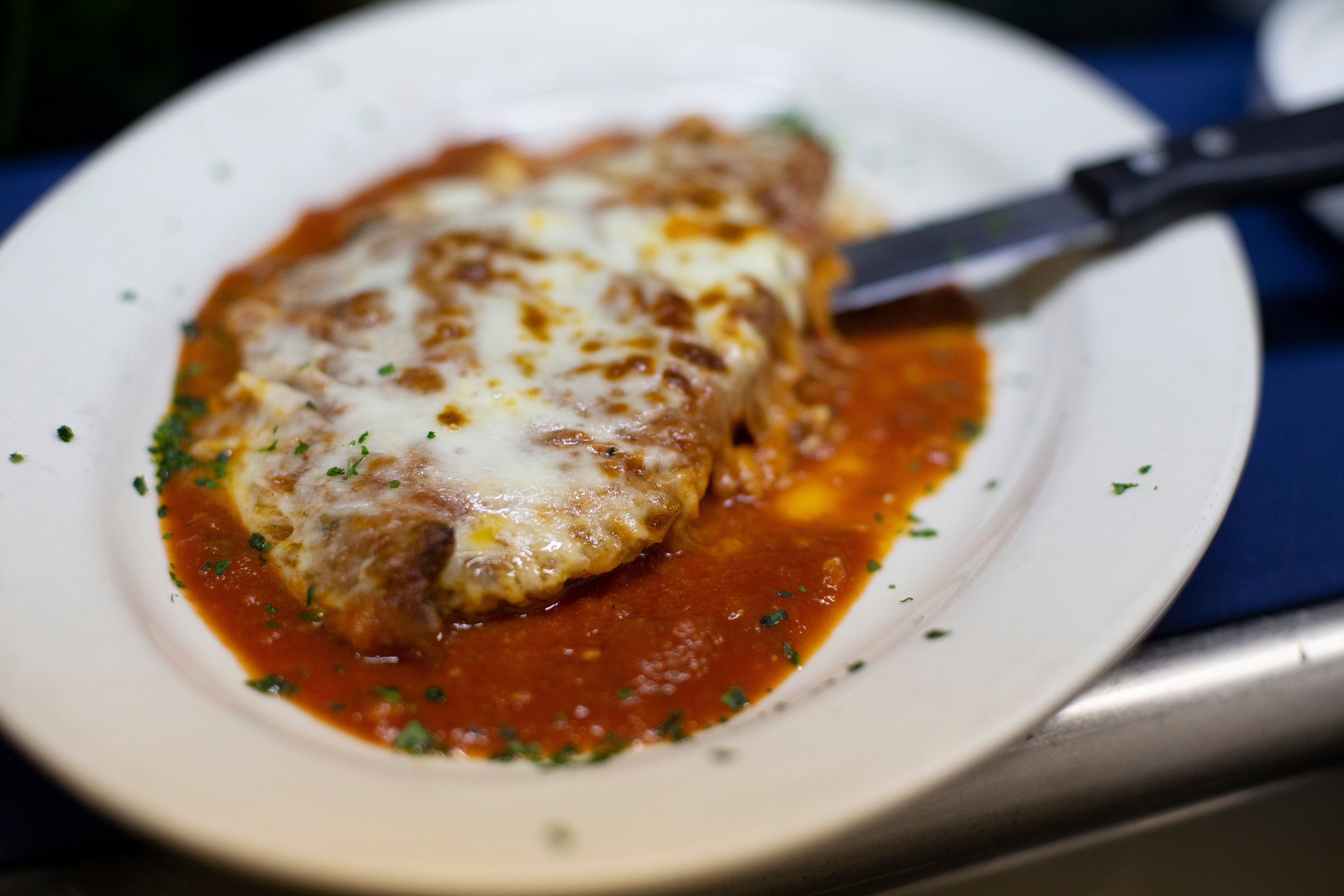 Eggplant parmigiana with tomato sauce and melted mozzarella