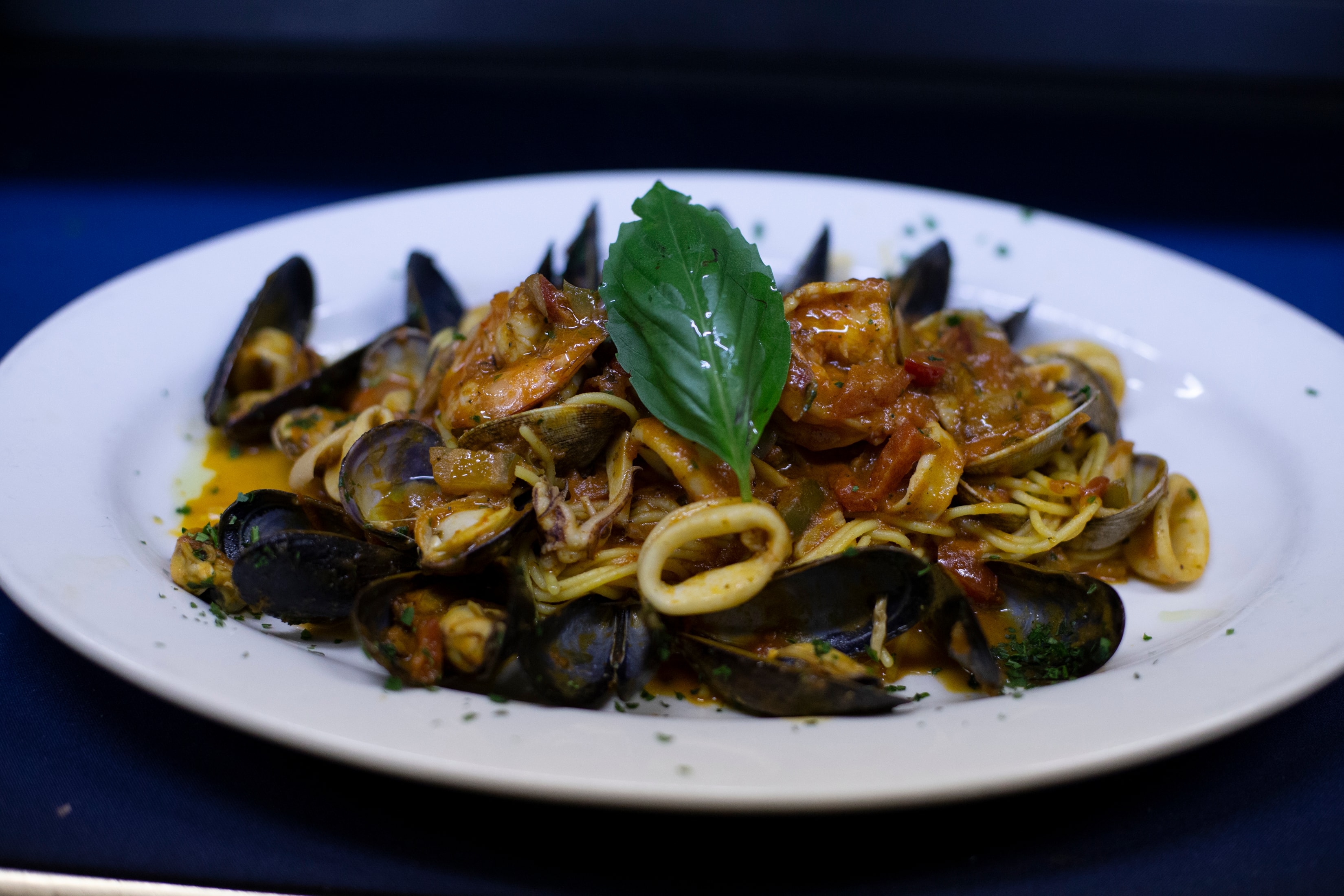 Linguine with mussels, shrimp and clams in tomato sauce