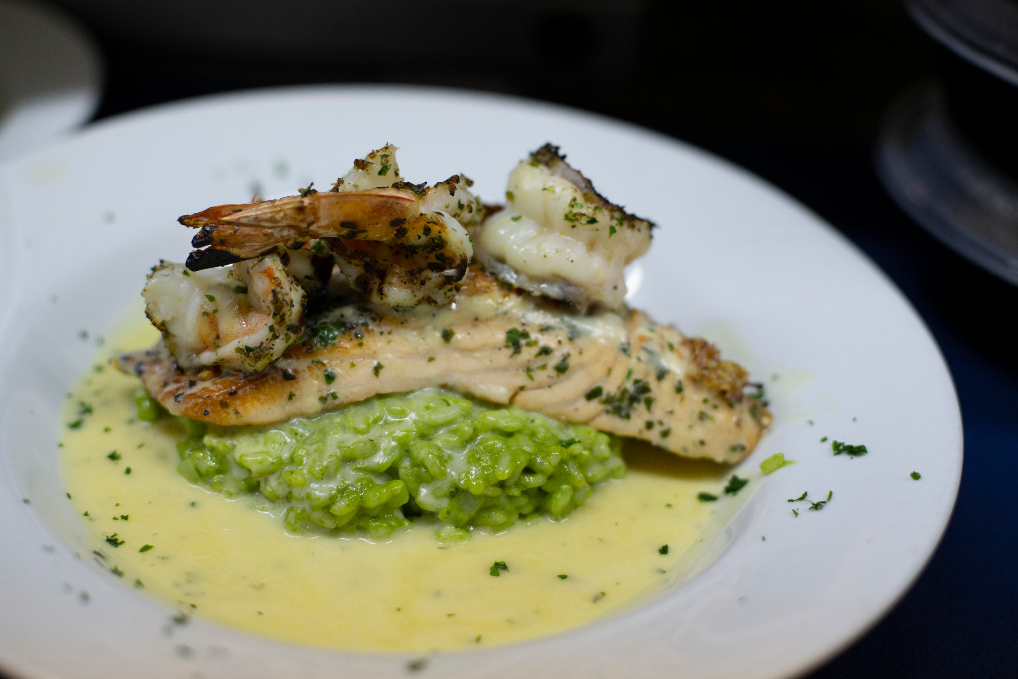 Salmon and shrimp over pea risotto with lemon butter sauce