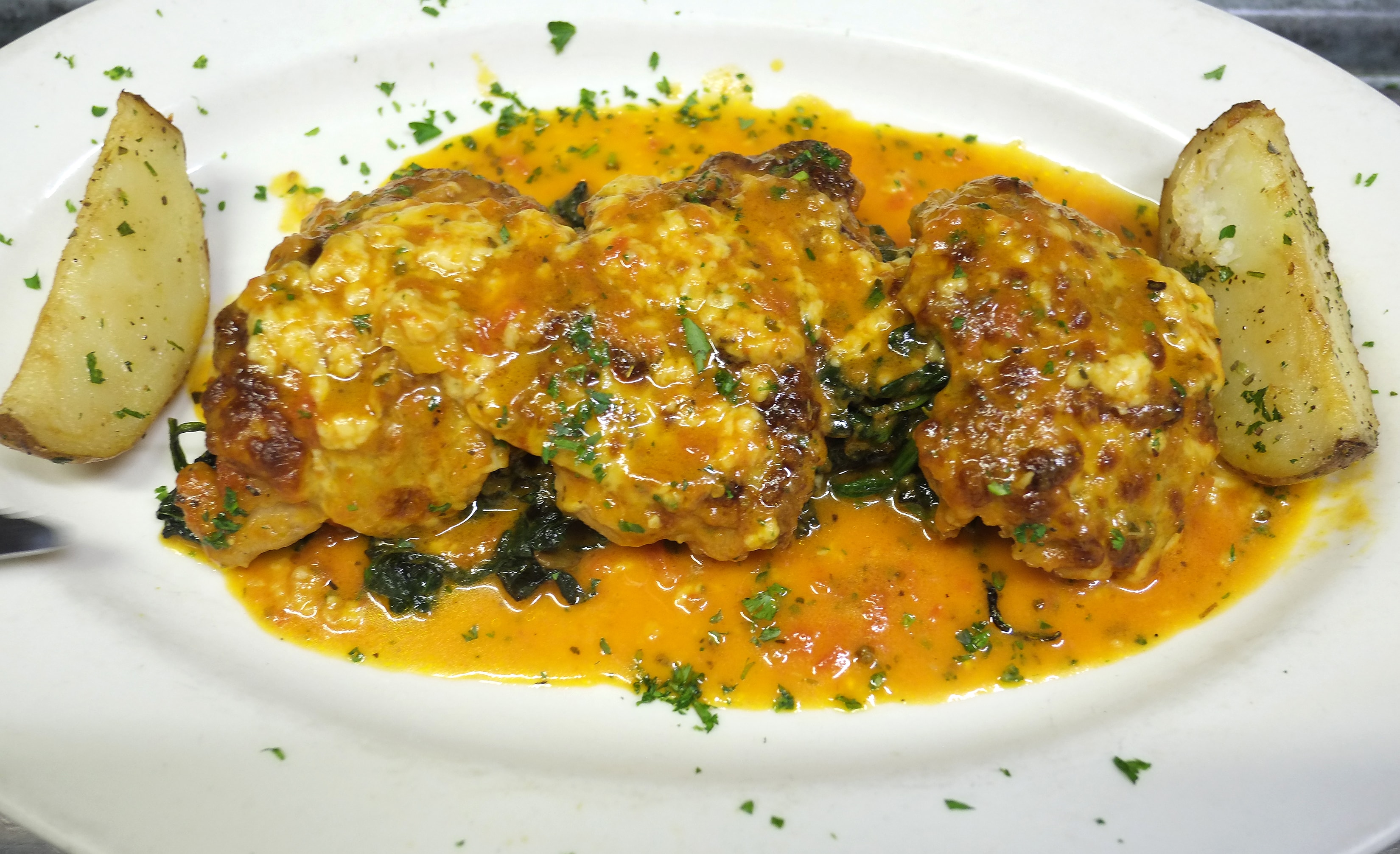 Seafood with sauce and roasted potatoes