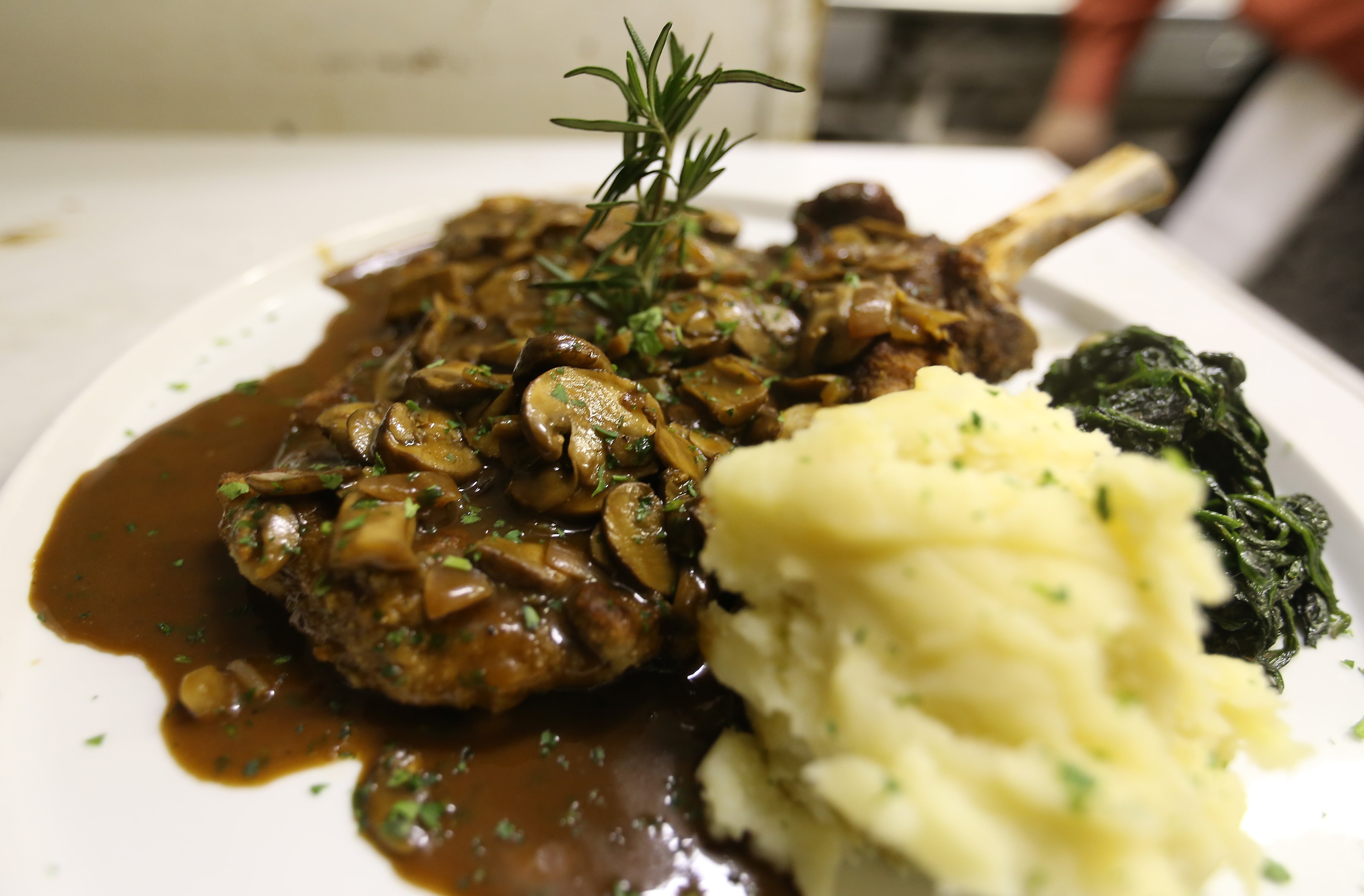 Veal chop with mushroom sauce and mashed potatoes